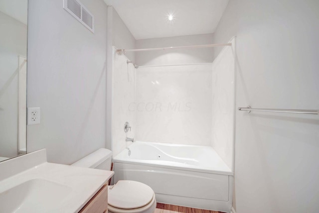 full bathroom featuring vanity, hardwood / wood-style flooring, toilet, and shower / bathtub combination