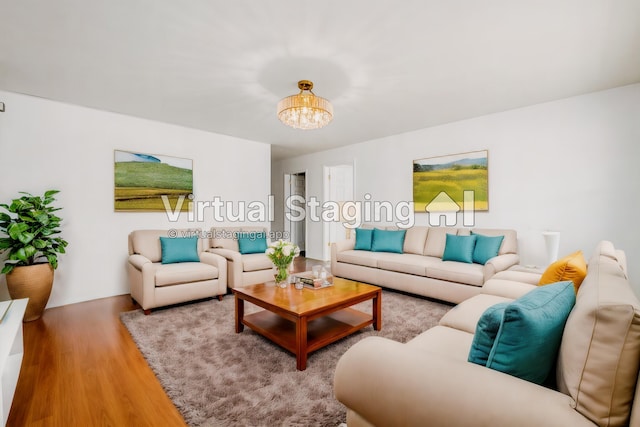 living room featuring light hardwood / wood-style flooring and a chandelier