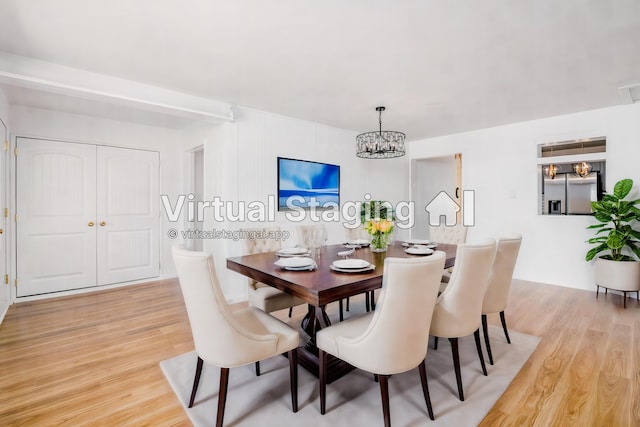 dining area with light hardwood / wood-style floors