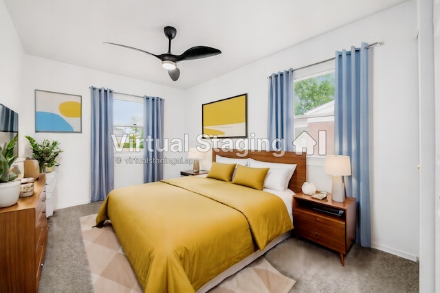 carpeted bedroom with ceiling fan