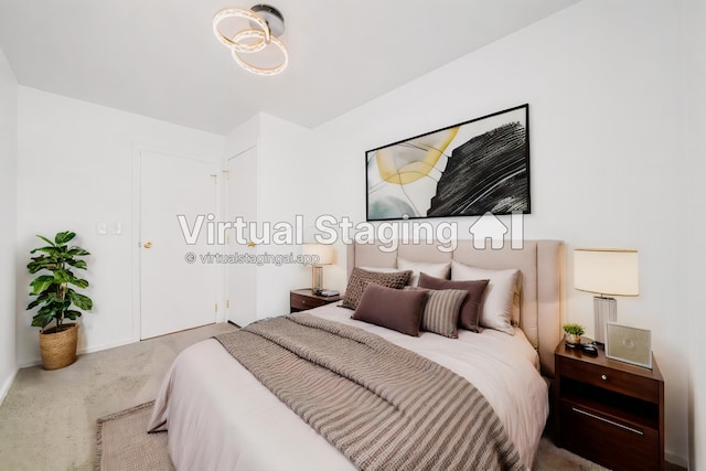 bedroom featuring light colored carpet