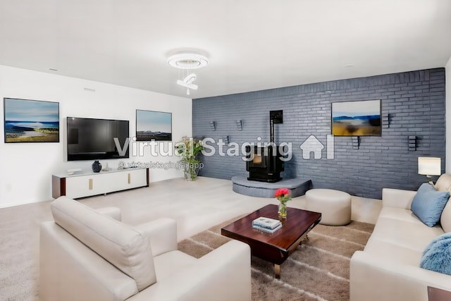 living room with carpet flooring, a wood stove, and brick wall