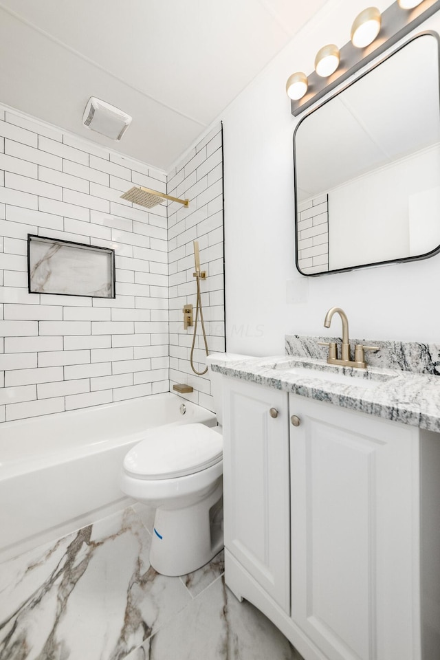 full bathroom featuring vanity, toilet, and tiled shower / bath combo