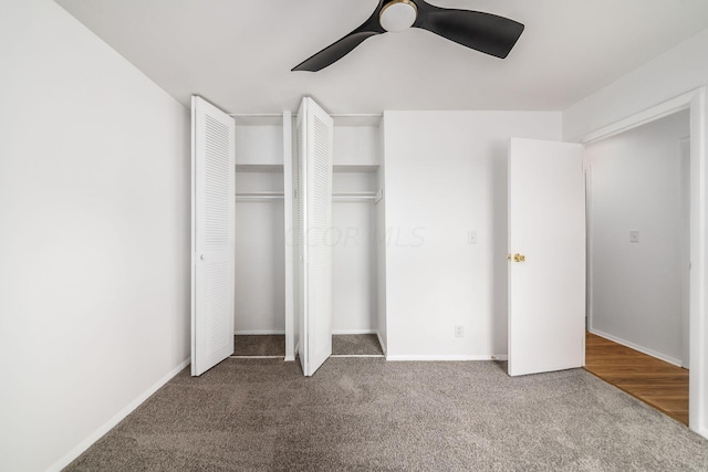 unfurnished bedroom featuring carpet floors and ceiling fan