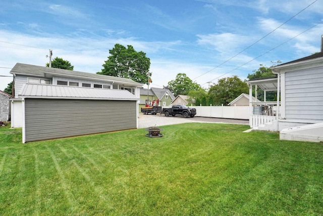 view of yard with a fire pit