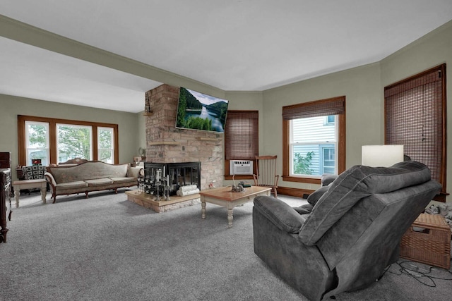 living room featuring carpet flooring and a stone fireplace