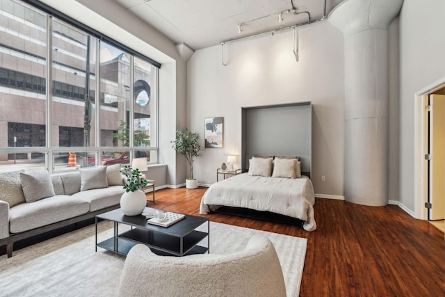 221 N Front St Unit 101, Columbus, OH 43215 - bedroom featuring wood finished floors and track lighting