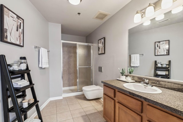 bathroom featuring tile patterned flooring, vanity, toilet, and a shower with shower door