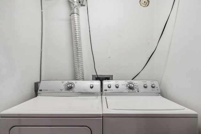 laundry area with washing machine and clothes dryer