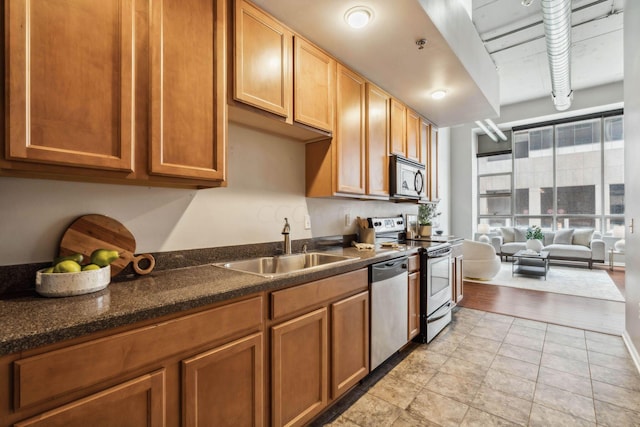 kitchen with sink and appliances with stainless steel finishes