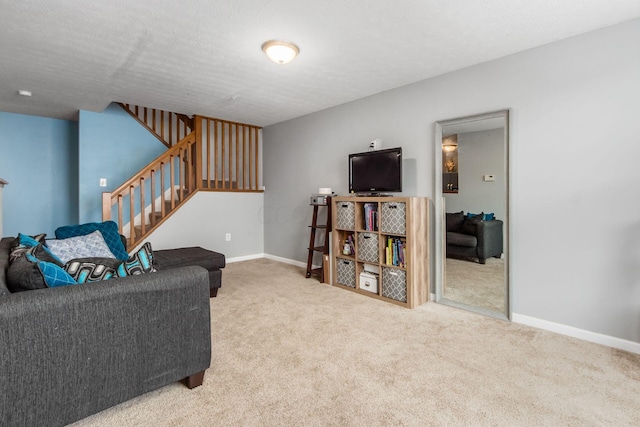 carpeted living room featuring a textured ceiling