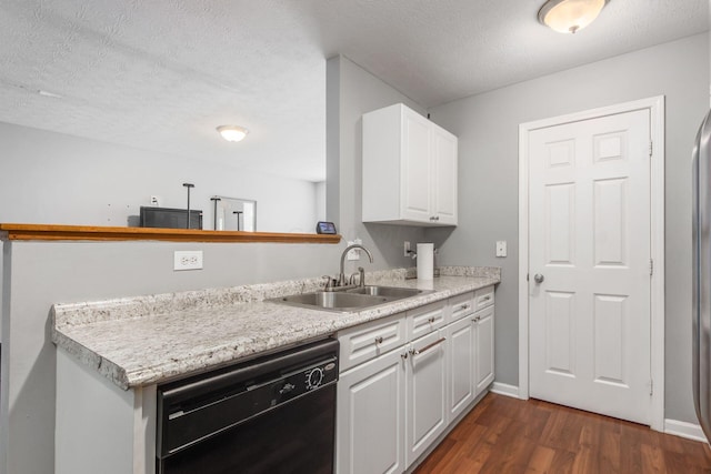 kitchen with dark hardwood / wood-style flooring, a textured ceiling, sink, dishwasher, and white cabinetry