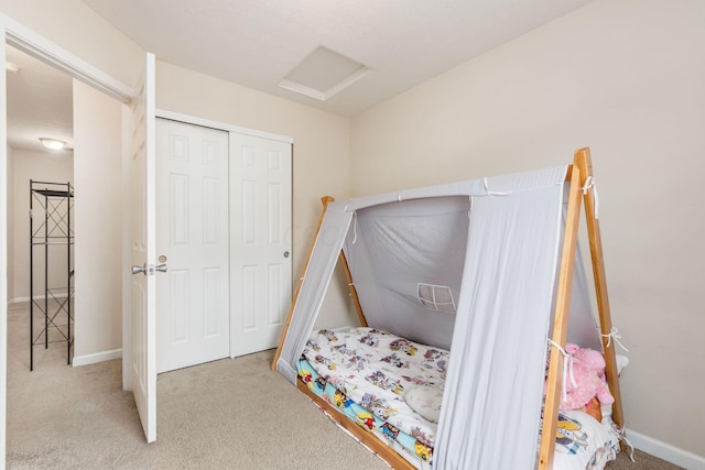 carpeted bedroom featuring a closet