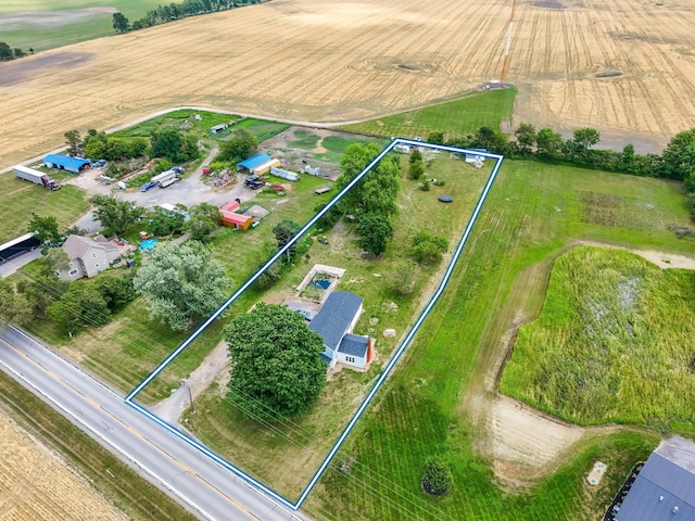 birds eye view of property featuring a rural view