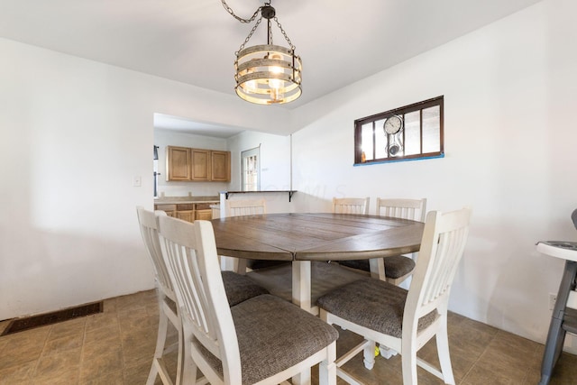 dining space featuring a chandelier