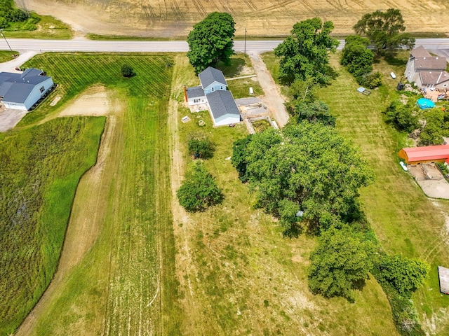 birds eye view of property featuring a rural view