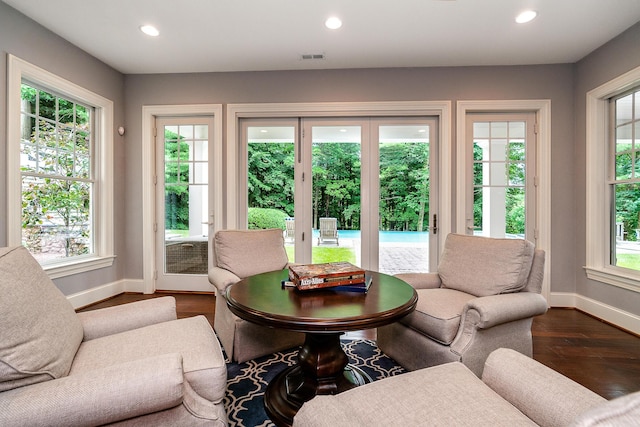 living room with plenty of natural light and hardwood / wood-style floors