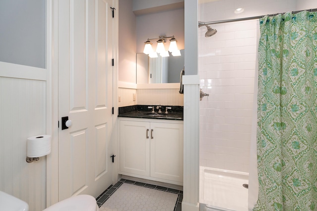 bathroom with tile patterned floors, vanity, and curtained shower