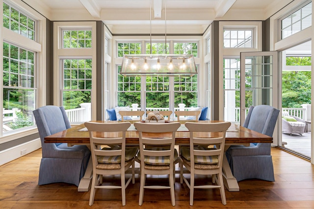 sunroom featuring beamed ceiling