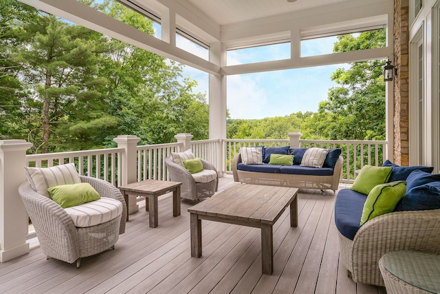 wooden deck with an outdoor living space