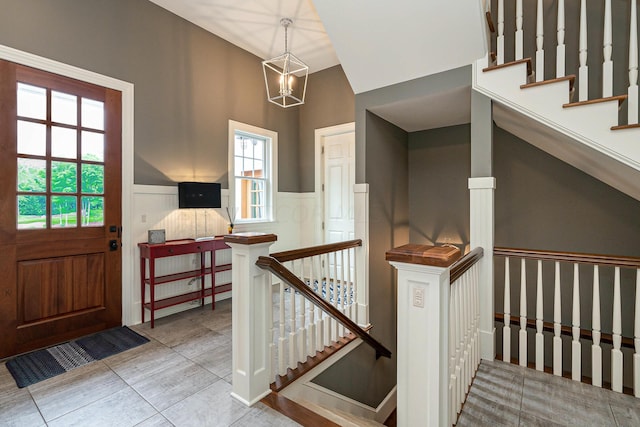 foyer with a chandelier