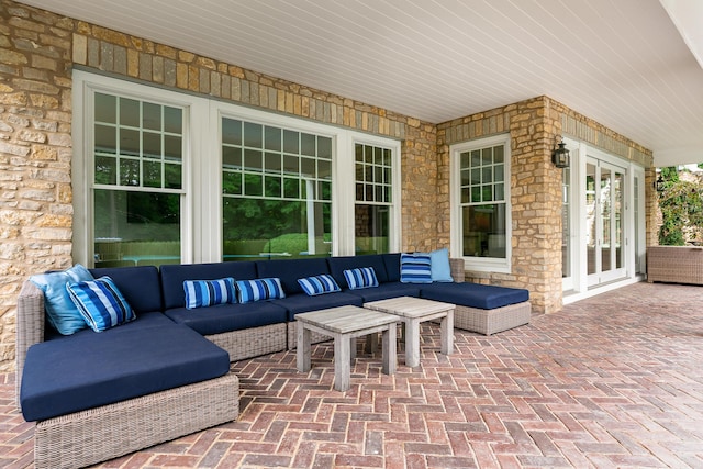 view of patio with an outdoor living space and french doors