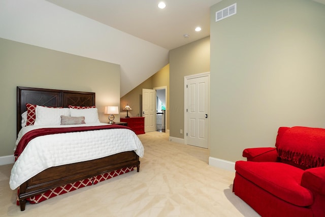 carpeted bedroom featuring vaulted ceiling