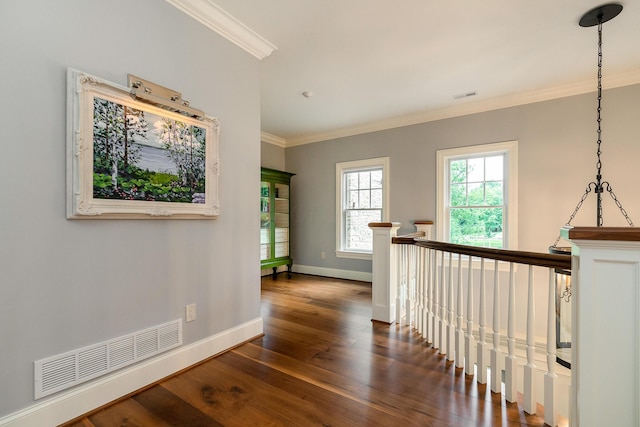 hall with dark hardwood / wood-style flooring and ornamental molding