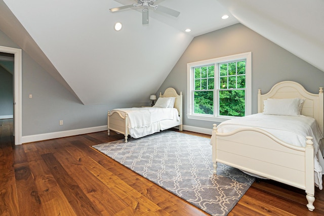 bedroom featuring ceiling fan, wood-type flooring, and vaulted ceiling