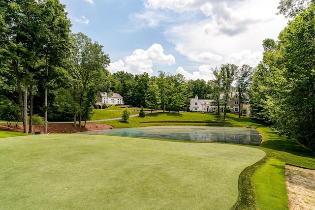 surrounding community featuring a yard and a water view