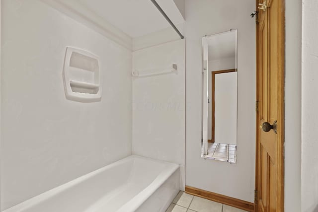 bathroom featuring tile patterned flooring and shower / bathtub combination