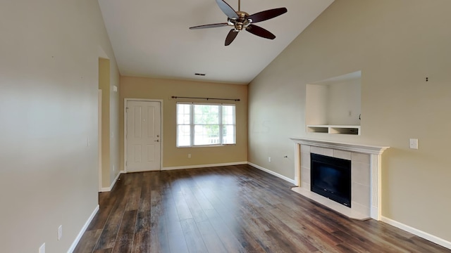 unfurnished living room featuring ceiling fan, a fireplace, high vaulted ceiling, and dark wood-type flooring