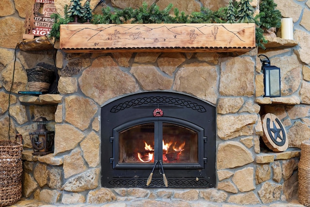 17441 Keister Rd, Laurelville, OH 43135 - detailed view of stone siding and a lit fireplace