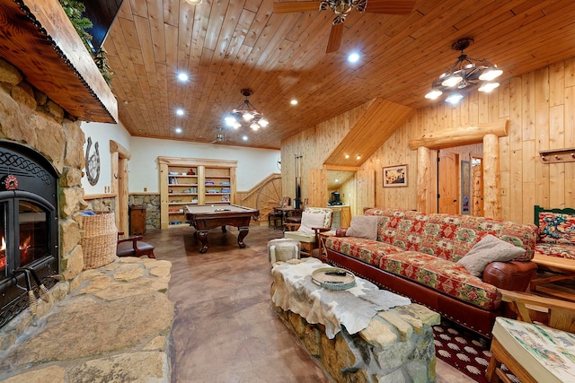 living room featuring a wood stove, wood ceiling, and wood walls