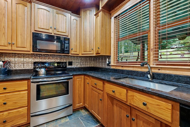 kitchen featuring backsplash, black microwave, sink, and stainless steel electric range