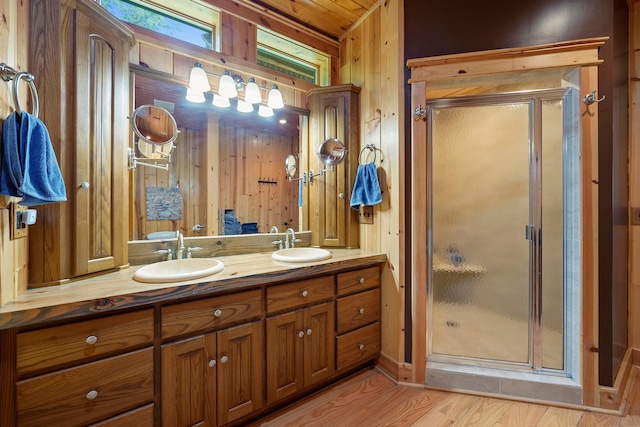 17441 Keister Rd, Laurelville, OH 43135 - full bath with double vanity, a shower stall, wood finished floors, and wooden walls