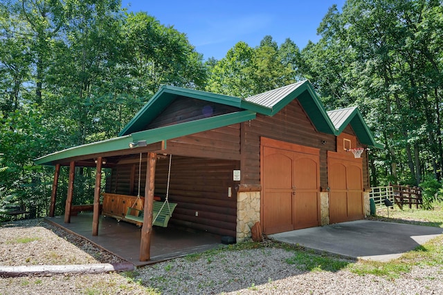 17441 Keister Rd, Laurelville, OH 43135 - view of home's exterior featuring a metal roof, an outbuilding, and stone siding
