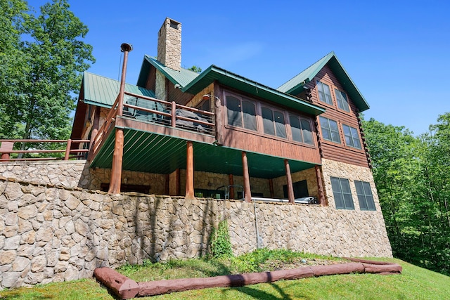 17441 Keister Rd, Laurelville, OH 43135 - rear view of property with stone siding, a chimney, a metal roof, and a deck