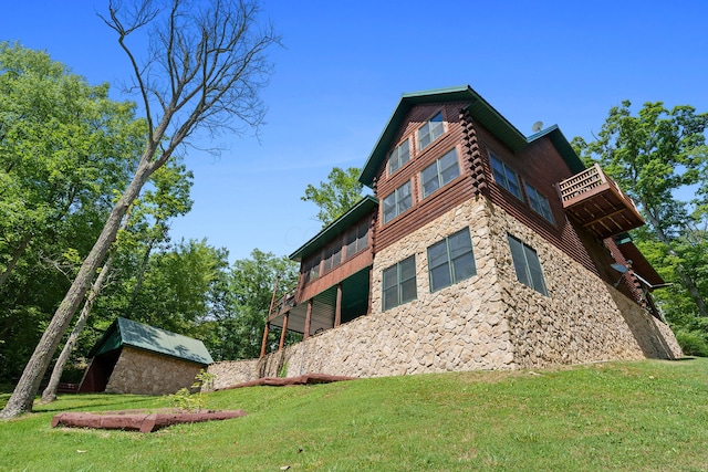 17441 Keister Rd, Laurelville, OH 43135 - view of side of property with stone siding, a lawn, and a storage unit