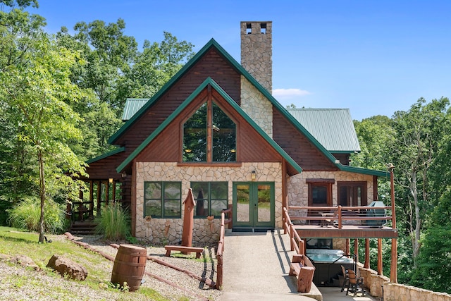 back of property featuring french doors and a wooden deck