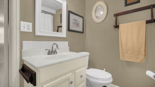 bathroom with vanity and toilet