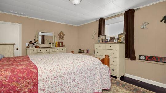 bedroom featuring ornamental molding