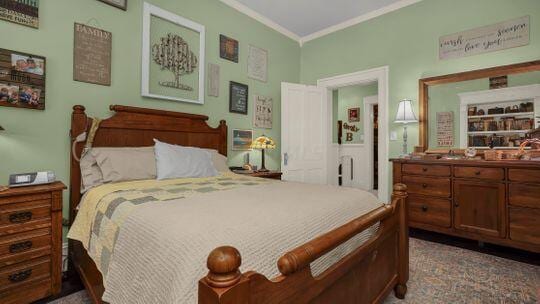 bedroom with crown molding