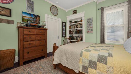 bedroom with crown molding