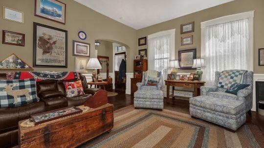 living area with hardwood / wood-style floors and a fireplace