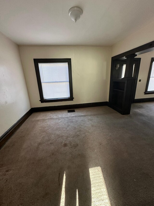 spare room featuring carpet floors