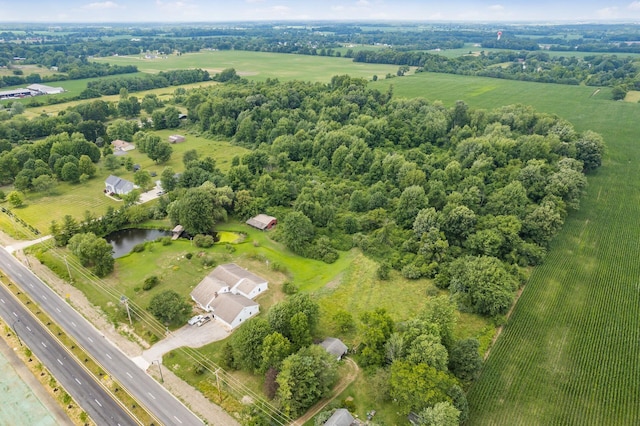 aerial view featuring a rural view and a water view