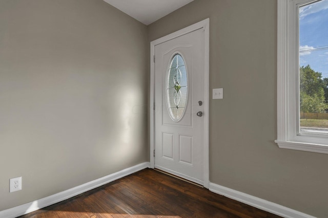 foyer with dark hardwood / wood-style floors