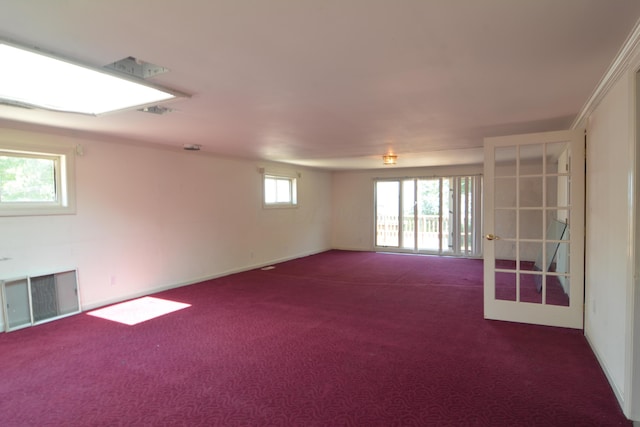 unfurnished room with dark colored carpet