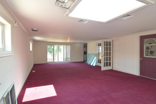 spare room featuring carpet flooring and ornamental molding